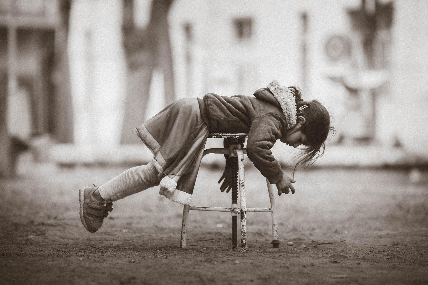 Black-and-white photo “Girl on chair” by Gabriel — matte print