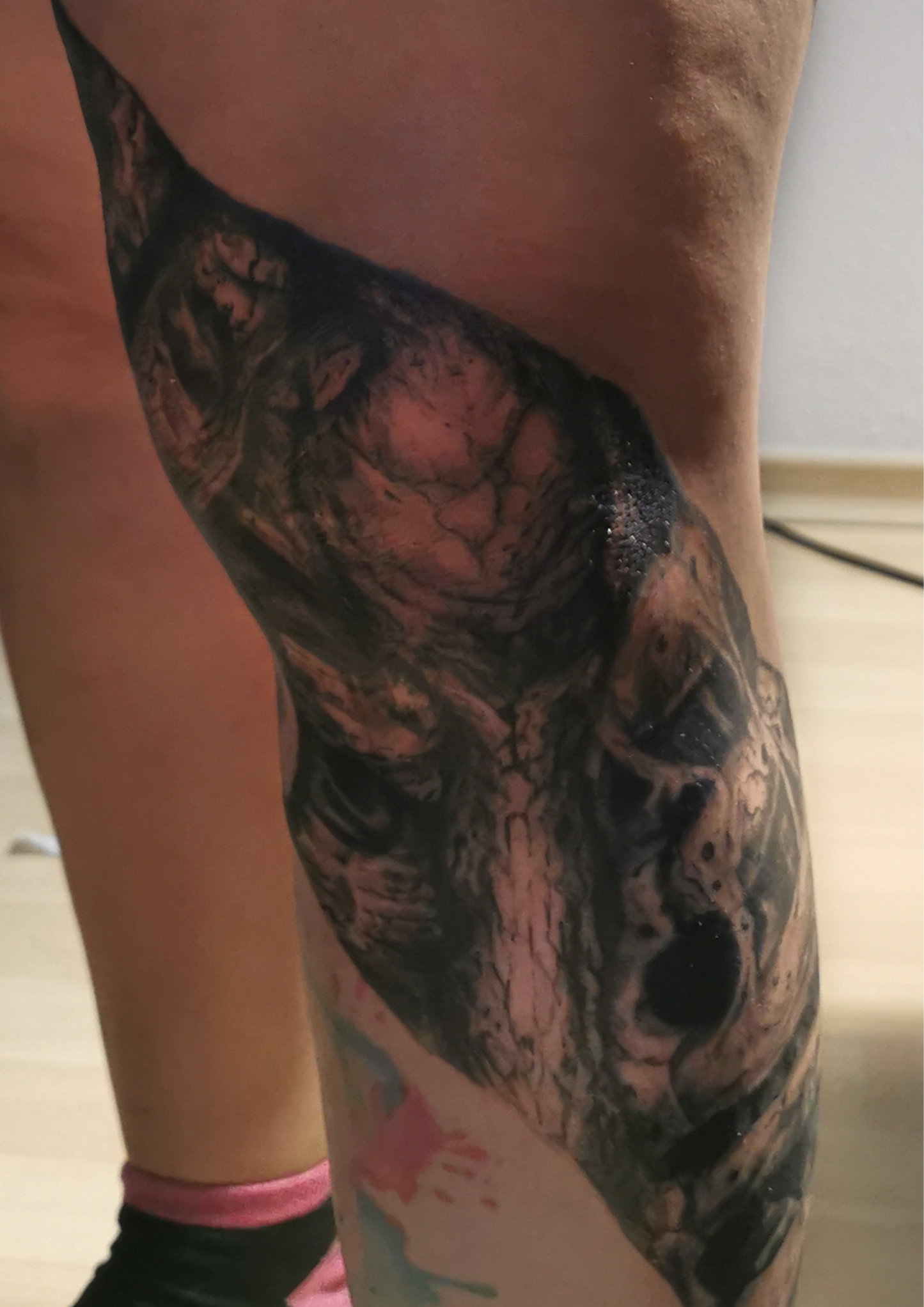 Detailed freehand full leg cover up skulls and bones 