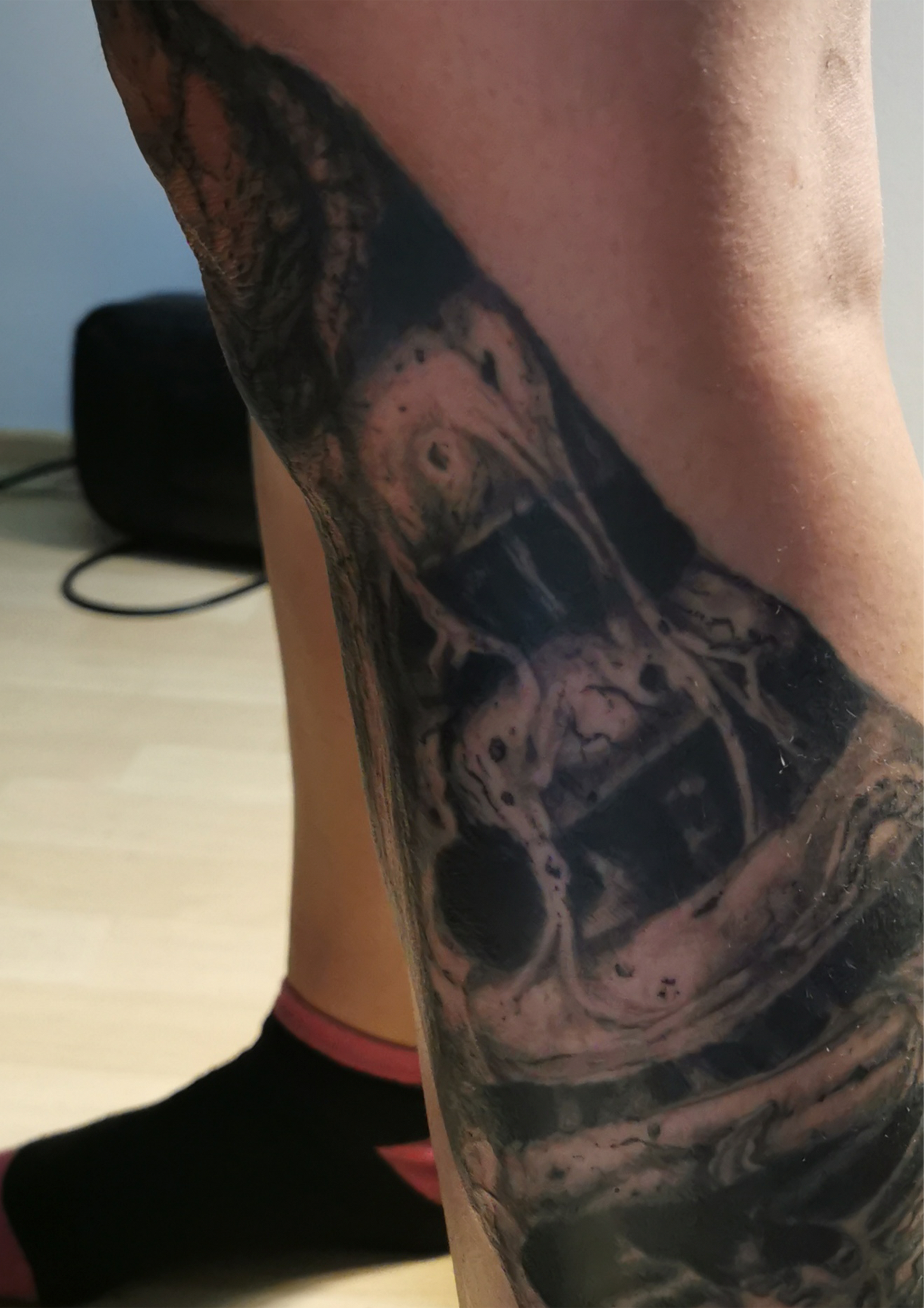 Detailed freehand full leg cover up skulls and bones 