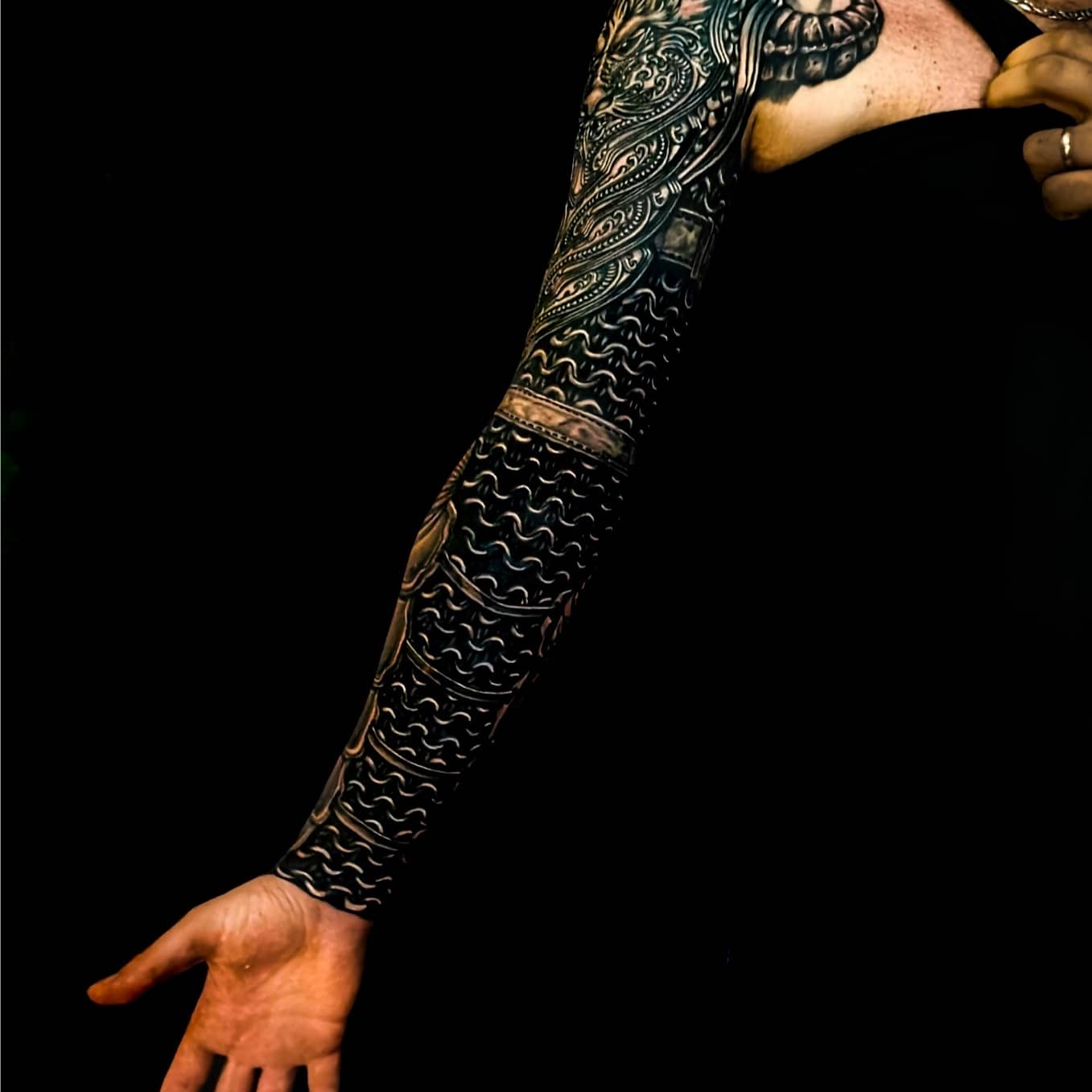 Detailed freehand cover up metallic arm armor on a black background