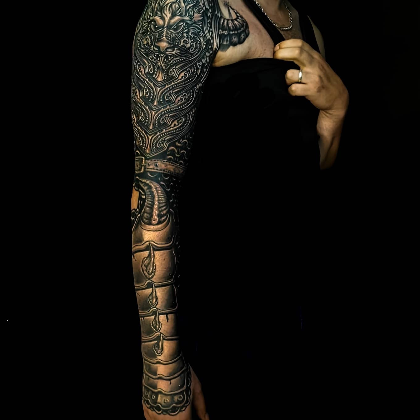 Detailed freehand cover up metallic arm armor on a black background