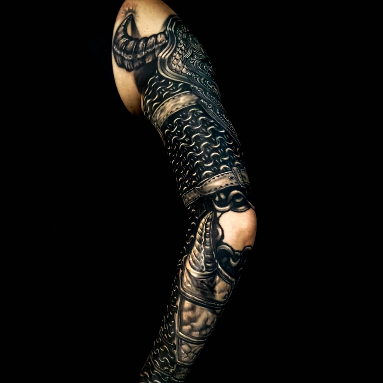 Detailed freehand cover up metallic arm armor on a black background