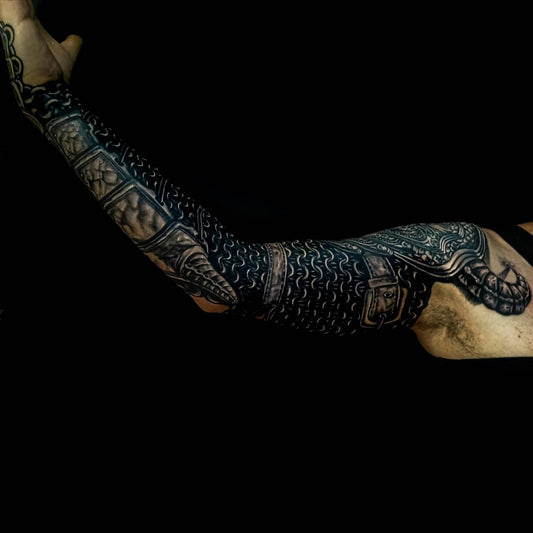 Detailed freehand cover up metallic arm armor on a black background